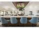 Modern bar with blue stools and large TVs at 24404 S Boxwood Dr, Sun Lakes, AZ 85248