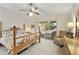 Main bedroom with a king-size bed, ceiling fan, and patio access at 24404 S Boxwood Dr, Sun Lakes, AZ 85248