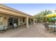 Covered patio with seating area and access to the backyard at 24404 S Boxwood Dr, Sun Lakes, AZ 85248