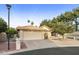 Tan house with tile roof, two-car garage, and landscaped yard at 24404 S Boxwood Dr, Sun Lakes, AZ 85248