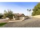 Landscaped yard with gravel and a view of the house's side elevation at 24404 S Boxwood Dr, Sun Lakes, AZ 85248