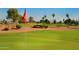 View of a putting green with flag and homes in background at 24404 S Boxwood Dr, Sun Lakes, AZ 85248