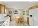 Bright kitchen with wood cabinets, tiled floor, and a breakfast nook at 24404 S Boxwood Dr, Sun Lakes, AZ 85248