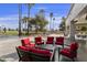 Patio furniture with red cushions and golf course view at 24404 S Boxwood Dr, Sun Lakes, AZ 85248