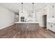 Spacious kitchen featuring an island, stainless steel appliances, and plenty of cabinet space at 32962 N 131St Dr, Peoria, AZ 85383