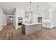 Spacious kitchen featuring an island, stainless steel appliances, and plenty of cabinet space at 32962 N 131St Dr, Peoria, AZ 85383
