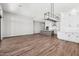 Open concept living room and kitchen space with wood flooring and large island at 32962 N 131St Dr, Peoria, AZ 85383