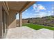 Spacious outdoor patio featuring desert landscaping with decorative rock and synthetic grass at 32994 N 131St Dr, Peoria, AZ 85383
