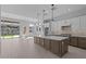 Bright, open kitchen with a spacious island, modern appliances, and stylish finishes at 32994 N 131St Dr, Peoria, AZ 85383