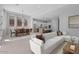Spacious living room with a comfortable sectional sofa and view into the modern kitchen at 32994 N 131St Dr, Peoria, AZ 85383
