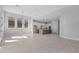 Spacious living area showcasing tile floors, recessed lighting, and contemporary finishes at 32994 N 131St Dr, Peoria, AZ 85383
