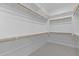 Large walk-in closet with built-in shelving and ample storage space at 32994 N 131St Dr, Peoria, AZ 85383