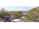 The backyard has views of other homes and desert trees beyond the block wall, creating a beautiful setting at 3650 N Barron --, Mesa, AZ 85207