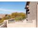 Balcony with railing offering neighborhood views of mature desert trees and single story homes on a sunny day at 3650 N Barron --, Mesa, AZ 85207