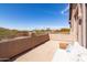 Expansive balcony with railing, desert views, and cozy seating area for relaxing and enjoying the outdoors at 3650 N Barron --, Mesa, AZ 85207