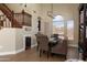 Elegant dining area with a wine fridge, staircase, and an arched window view at 3650 N Barron --, Mesa, AZ 85207