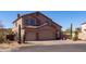 Inviting two-story home boasts a spacious three-car garage and desert landscaping at 3650 N Barron --, Mesa, AZ 85207