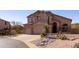 Inviting two-story home boasts a spacious three-car garage and desert landscaping at 3650 N Barron --, Mesa, AZ 85207