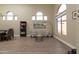 Bright living room featuring tile floors, stylish furniture, and large arched windows at 3650 N Barron --, Mesa, AZ 85207