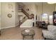 Spacious living area with high ceilings, elegant staircase, and modern furnishings at 3650 N Barron --, Mesa, AZ 85207