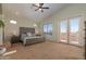 Spacious main bedroom features a large bed, vaulted ceiling, and private balcony with scenic views at 3650 N Barron --, Mesa, AZ 85207