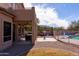 The covered patio overlooks a sparkling pool and outdoor kitchen; perfect for entertaining at 3650 N Barron --, Mesa, AZ 85207