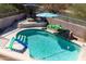 Inviting backyard pool and patio area, complete with relaxing lounge chairs and fun water toys for summer fun at 3650 N Barron --, Mesa, AZ 85207