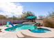 Enjoy the blue pool with slide and elevated spa in the low-maintenance backyard at 3650 N Barron --, Mesa, AZ 85207