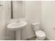 Clean bathroom with pedestal sink and toilet at 4045 S 177Th Ln, Goodyear, AZ 85338