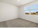 Well-lit bedroom with carpet and window at 4045 S 177Th Ln, Goodyear, AZ 85338