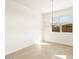 Bright dining area with tile floors and a modern chandelier at 4045 S 177Th Ln, Goodyear, AZ 85338