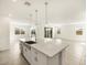 Modern kitchen with island and view into the adjacent living room at 4045 S 177Th Ln, Goodyear, AZ 85338