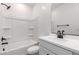 Bright bathroom featuring modern black fixtures, a tub and shower combination, and a white vanity at 8584 N 170Th Ln, Waddell, AZ 85355