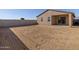 Large backyard with dirt and a block wall at 9109 N 173Rd Ln, Waddell, AZ 85355