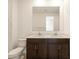 Bathroom with double vanity, modern sink, and toilet at 9109 N 173Rd Ln, Waddell, AZ 85355