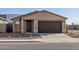 New home with a front yard, driveway, and a two-car garage at 9109 N 173Rd Ln, Waddell, AZ 85355