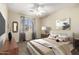 Tranquil bedroom with a plush bed, soft carpet, and a window providing natural light at 1335 E June St # 239, Mesa, AZ 85203