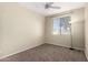 Well lit bedroom with neutral walls, ceiling fan, carpet flooring and a window with natural light at 1335 E June St # 239, Mesa, AZ 85203