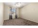 Cozy bedroom featuring carpet, a ceiling fan, and a window that allows for plenty of natural lighting at 1335 E June St # 239, Mesa, AZ 85203