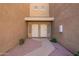 A front entrance showing two front doors to the units with stone gravel, and pavers leading to each door at 1335 E June St # 239, Mesa, AZ 85203
