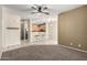 Bright living space featuring a view of the kitchen area with bar stool seating and overhead lighting at 1335 E June St # 239, Mesa, AZ 85203