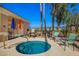 Community spa with a fenced pool area with patio seating and umbrellas at 1335 E June St # 239, Mesa, AZ 85203