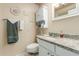 Bathroom with granite countertop vanity and white cabinets at 13428 N Hawthorn Dr, Sun City, AZ 85351