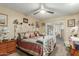 Bedroom with a white metal bed frame and southwestern-style bedding at 13428 N Hawthorn Dr, Sun City, AZ 85351