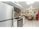Bright kitchen features granite countertops, stainless steel appliances, and a dining area at 13428 N Hawthorn Dr, Sun City, AZ 85351