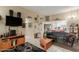 Living room with tiled floors and partial kitchen view at 13428 N Hawthorn Dr, Sun City, AZ 85351
