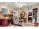 Home office with recliner, wooden desk, and ample storage at 13428 N Hawthorn Dr, Sun City, AZ 85351