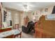 Home office features a recliner, desk, and built-in shelving at 13428 N Hawthorn Dr, Sun City, AZ 85351