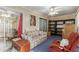 Bright sunroom features a comfy couch and sitting chair, providing a relaxing space at 13428 N Hawthorn Dr, Sun City, AZ 85351