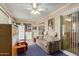 Spacious sunroom with seating area and storage shelving at 13428 N Hawthorn Dr, Sun City, AZ 85351